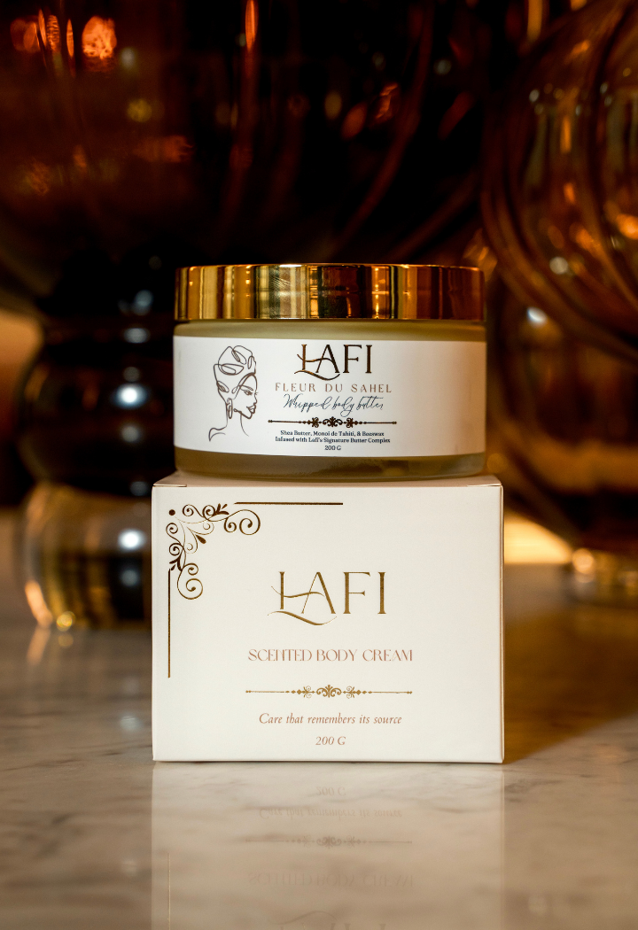 Lafi scented body cream jar and box on a reflective surface with blurred background