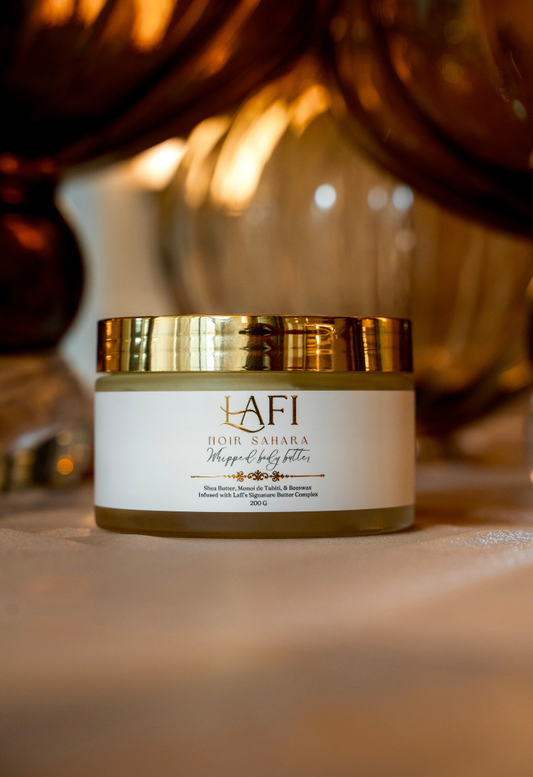 Gold and white lafi body butter jar with 'LAFI' branding on a blurred background
