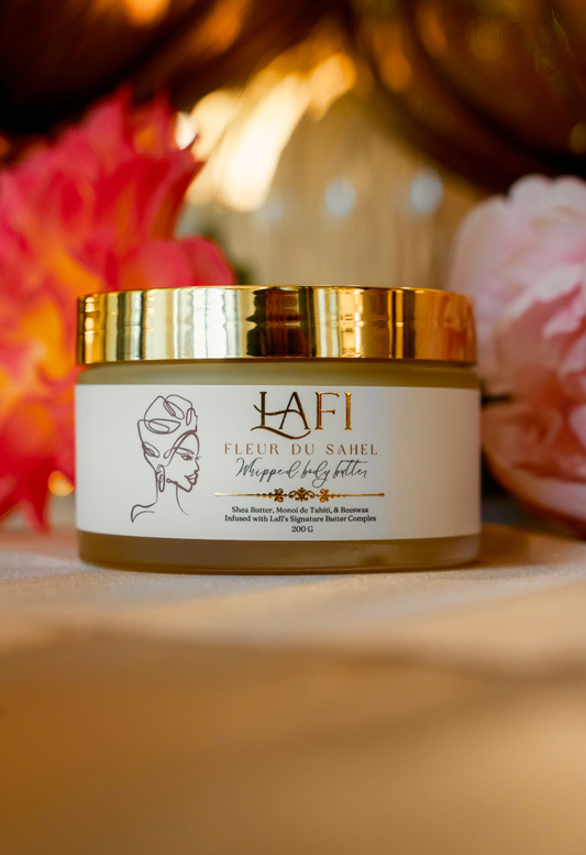 Jar of Lafi body butter with decorative flowers in the background
