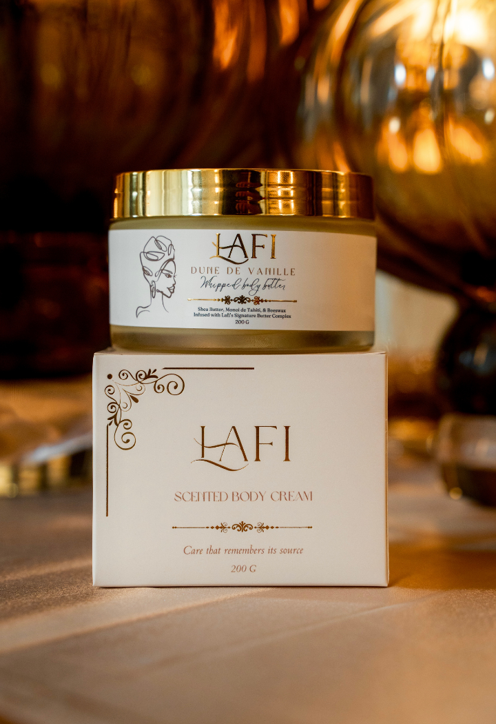 Lafi scented body cream jar and packaging on a silk surface with warm lighting.