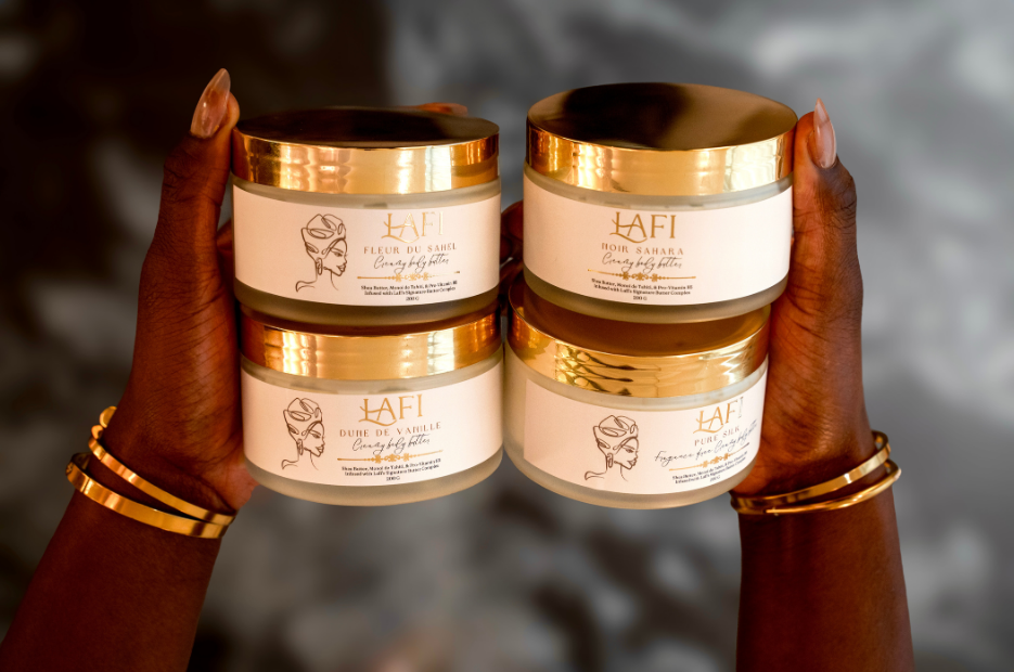 Two hands holding jars of Lafi skincare product jar against a blurred background