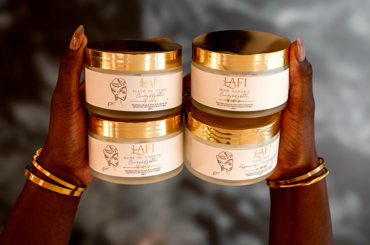 Two hands holding jars of Lafi skincare product jar against a blurred background